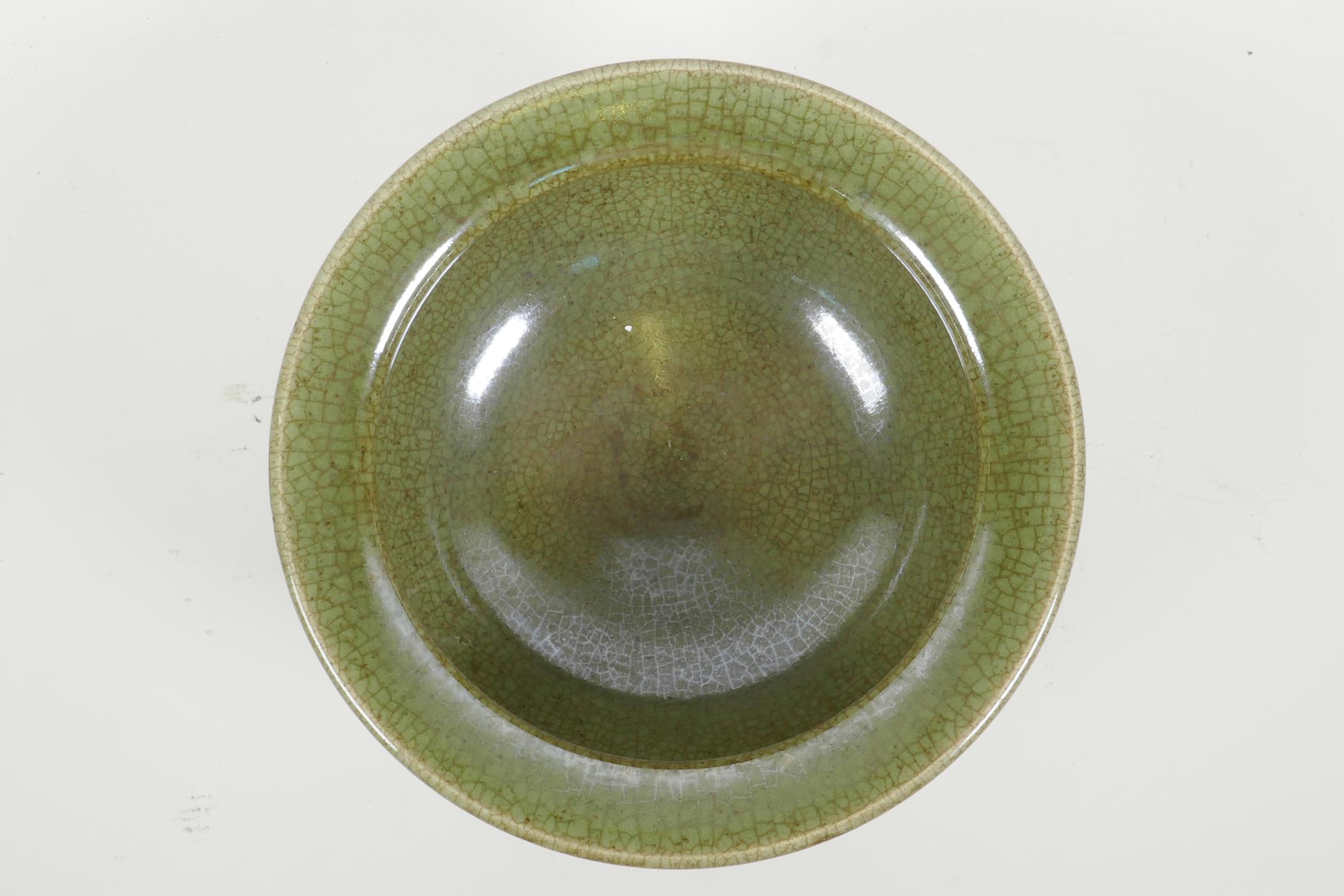 A Chinese olive green crackle glazed pottery bowl with tripod support, 9" diameter - Image 2 of 4