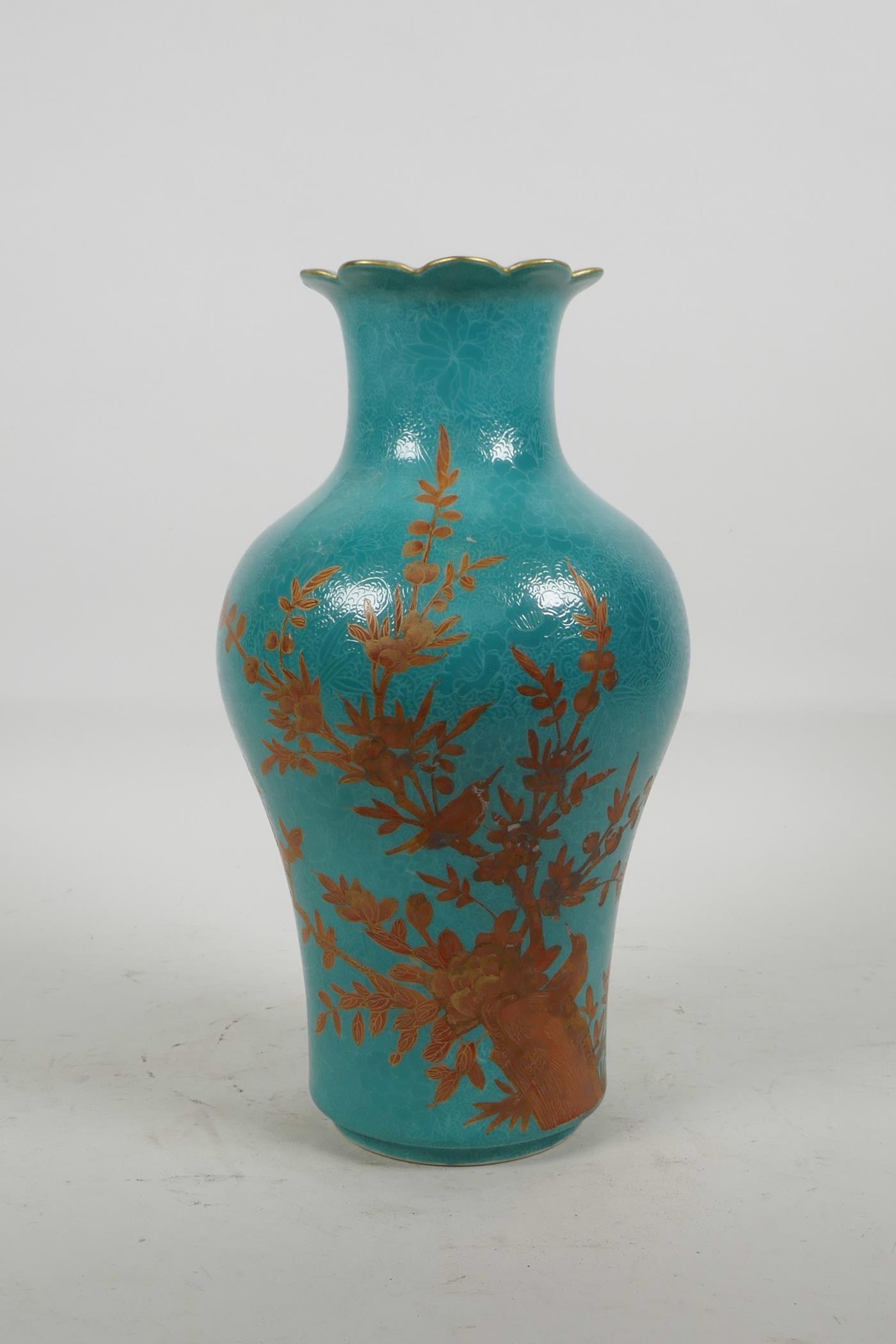 A Chinese blue ground porcelain vase with incised self coloured floral decoration, overpainted