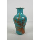 A Chinese blue ground porcelain vase with incised self coloured floral decoration, overpainted