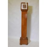 An Art Deco grandmother clock, marked S.D. Neill Belfast, in walnut with square dial and domed