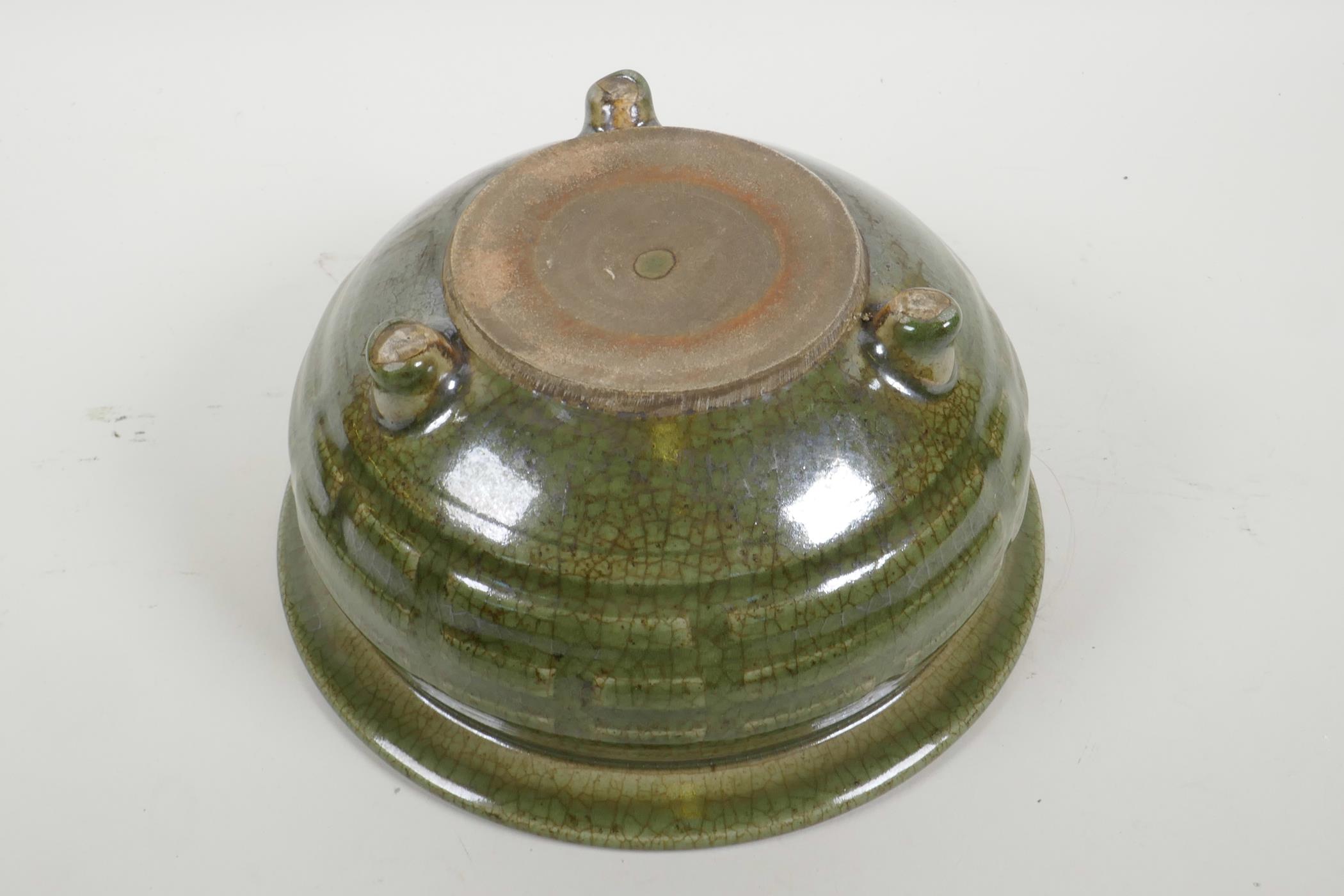 A Chinese olive green crackle glazed pottery bowl with tripod support, 9" diameter - Image 4 of 4