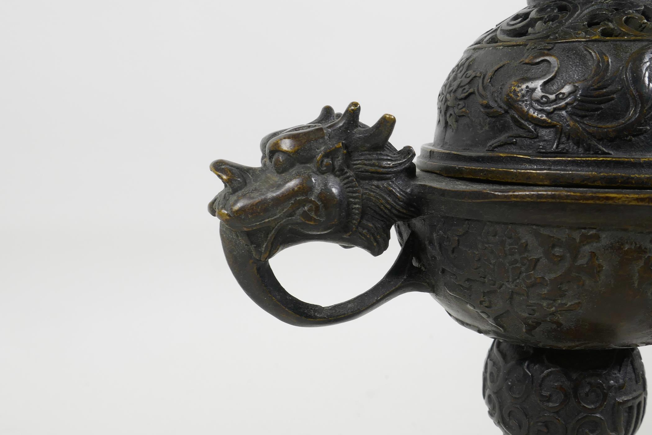 A Chinese bronze censer and cover with two dragon head handles and phoenix decoration to the - Image 3 of 5