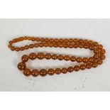 An amber graduated bead necklace, 28" long, 54g