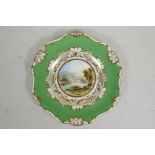 A mid C19th Davenport porcelain plate painted with a view on the Tiber, within a green and gilt