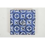 A Chinese blue and white porcelain tile decorated with a repeating pattern, 8" x 8"
