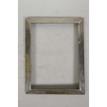 An American sterling silver photo frame with engraved foliate decoration, 7½" x 9½" overall