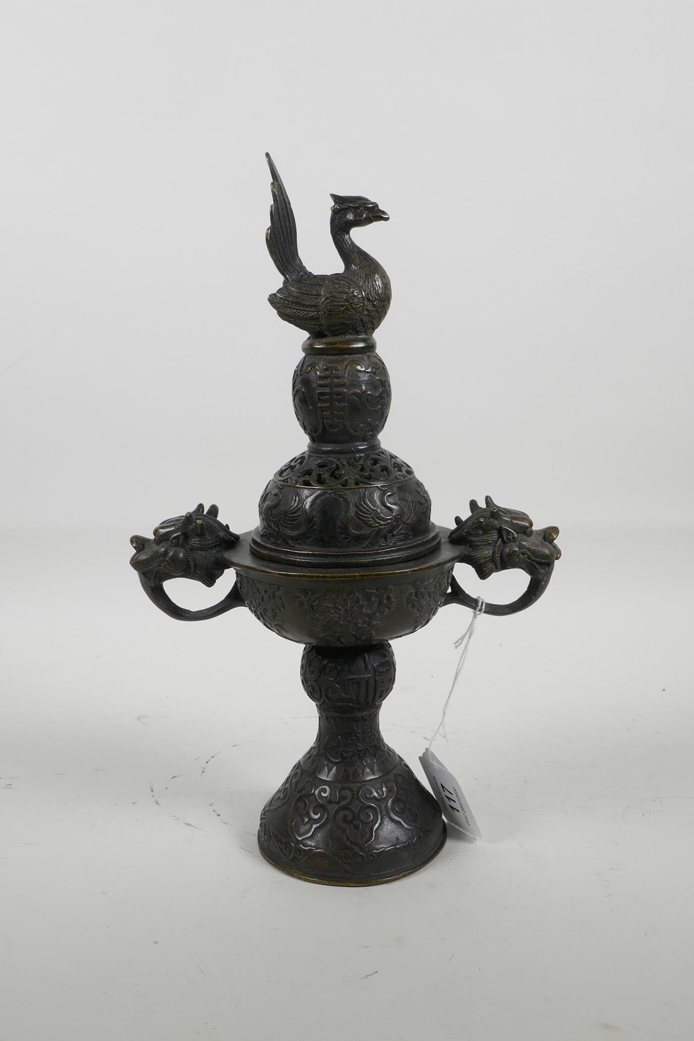 A Chinese bronze censer and cover with two dragon head handles and phoenix decoration to the