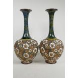 A pair of Doulton Lambeth Slaters Patent vases, decorated with flowers, 15½" high