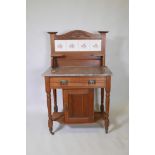 A C19th walnut washstand with single drawer and cupboard base with marble top and tile back, 47"