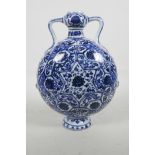 A Chinese blue and white porcelain moon flask with lotus flower decoration, 11" high