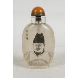 A Chinese reverse decorated snuff bottle depicting a Chinese emperor, character inscription verso,