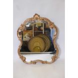 A Rococo style gilt framed wall mirror, 25" x 30"