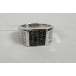 A gentleman's 925 silver ring set with cubic zirconium and marcasite, larger than size 'Z'