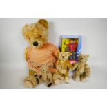 A Steiff teddy bear with original labels, 10" long, together with a Harrods replica bear, 10"