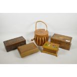Four wooden jewellery boxes of various designs, together with a leather jewellery container with