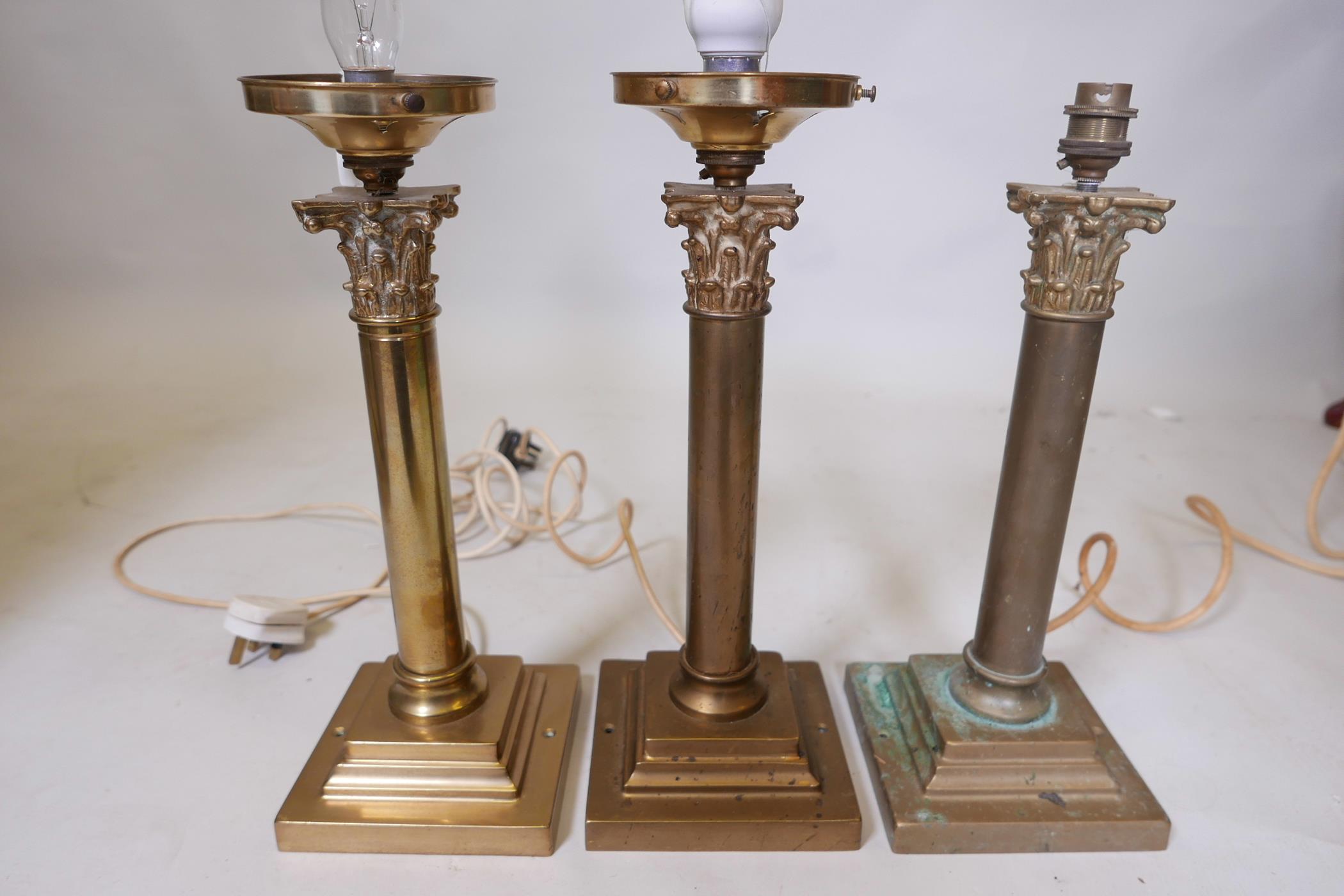 Three C19th brass Corinthian column table lamps, 15" high x 6" wide, A/F
