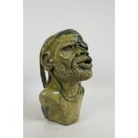 An African carved soapstone bust of a bearded gentleman, 11" high