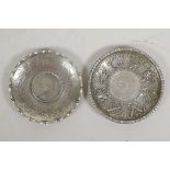 A pair of Chinese white metal coin dishes with embossed decoration, 4" diameter