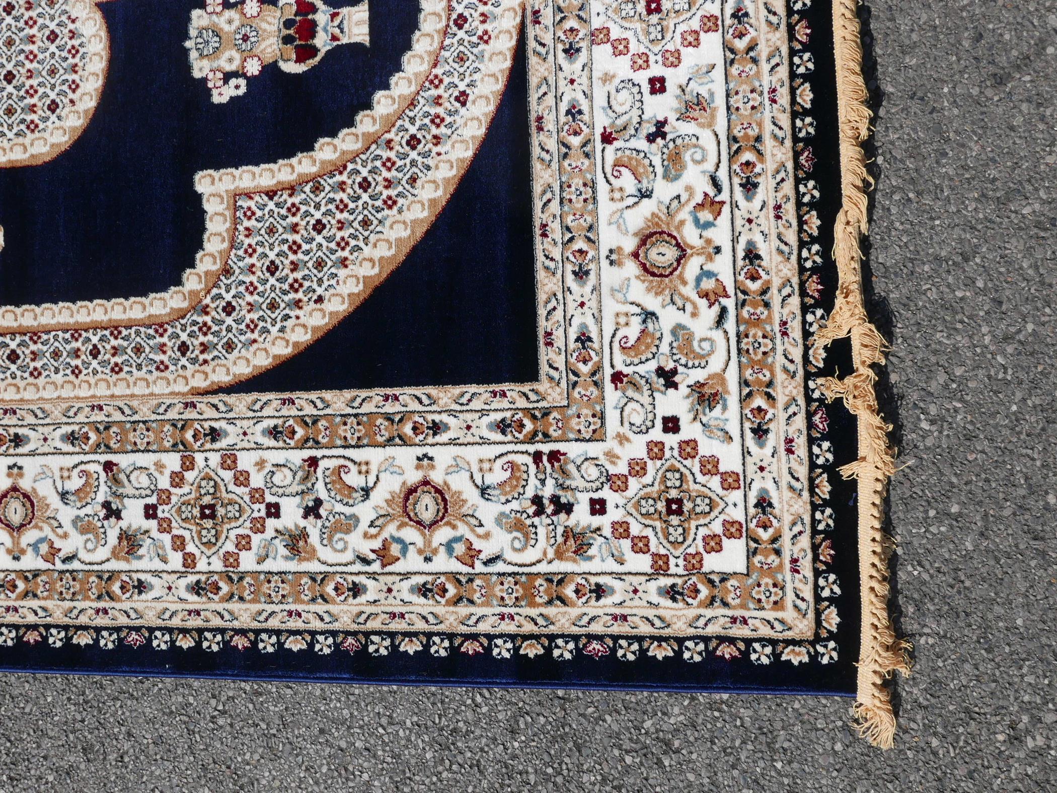 A large Turkish blue ground carpet with all over floral decoration, 118" x 240" - Image 6 of 7