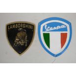 Two novelty painted cast metal automotive plaques, Vespa and Lamborghini, 7½" x 8½"