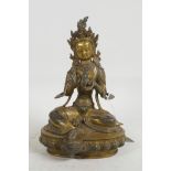 A Sino-Tibetan gilt bronzed metal of Shiva seated on a lotus throne, 8½" high