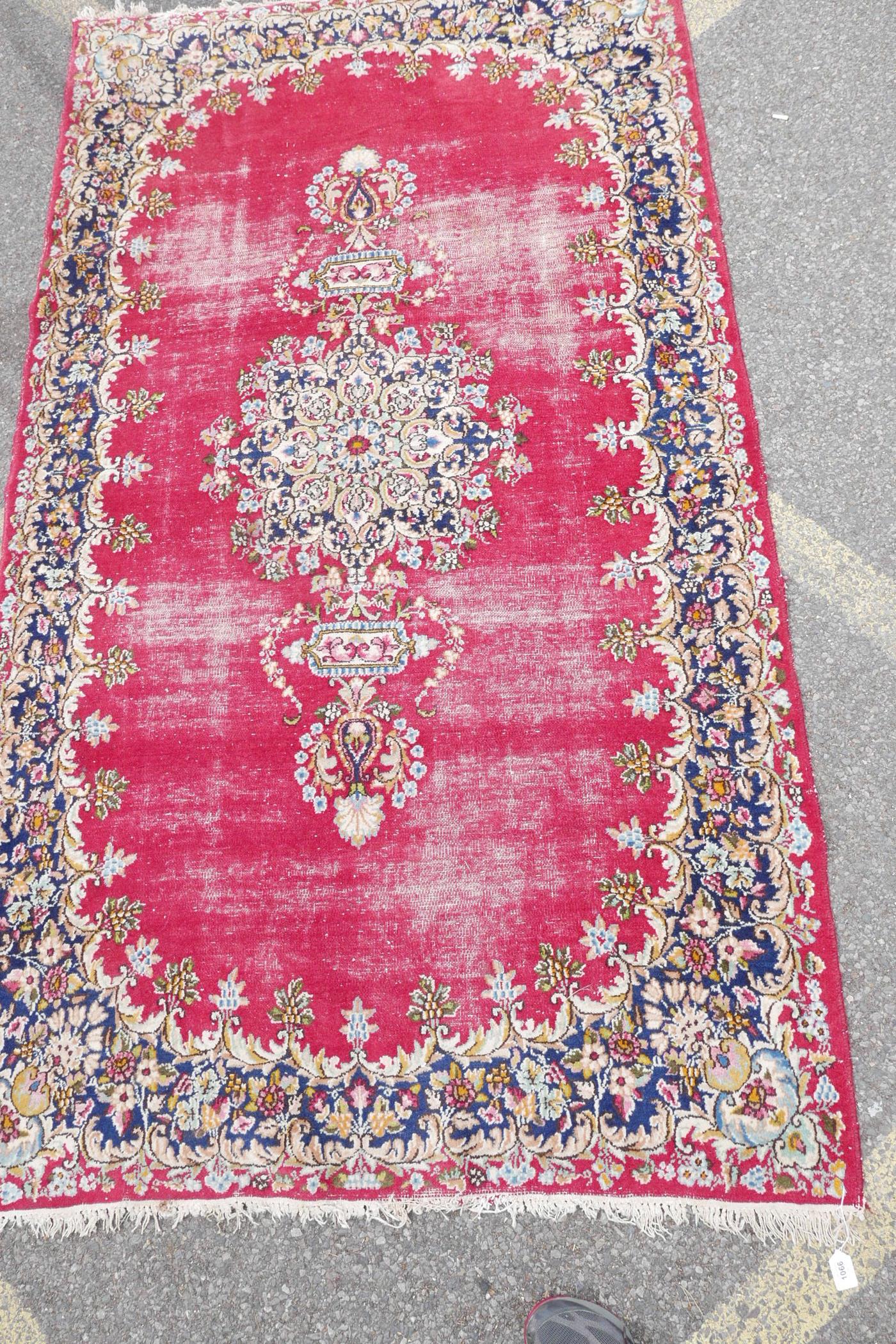 A red ground oriental pattern rug with ornate floral border (worn), 89" x 50" - Image 3 of 3