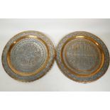 Two Middle Eastern copper and white metal wall plaques, with decoration of warriors and armed