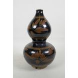A Chinese Cizhou kiln double gourd vase with leaf decoration, 10½" high