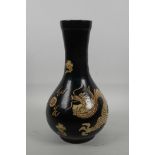 A Chinese Cizhou kiln pottery vase with dragon decoration, 11½" high