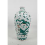 A Chinese famille verte porcelain vase with enamel decoration of a dragon chasing the flaming pearl,