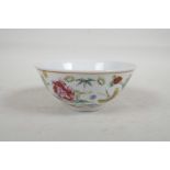 A Chinese Doucai porcelain rice bowl painted with butterflies and flowers in bright enamels, 5"