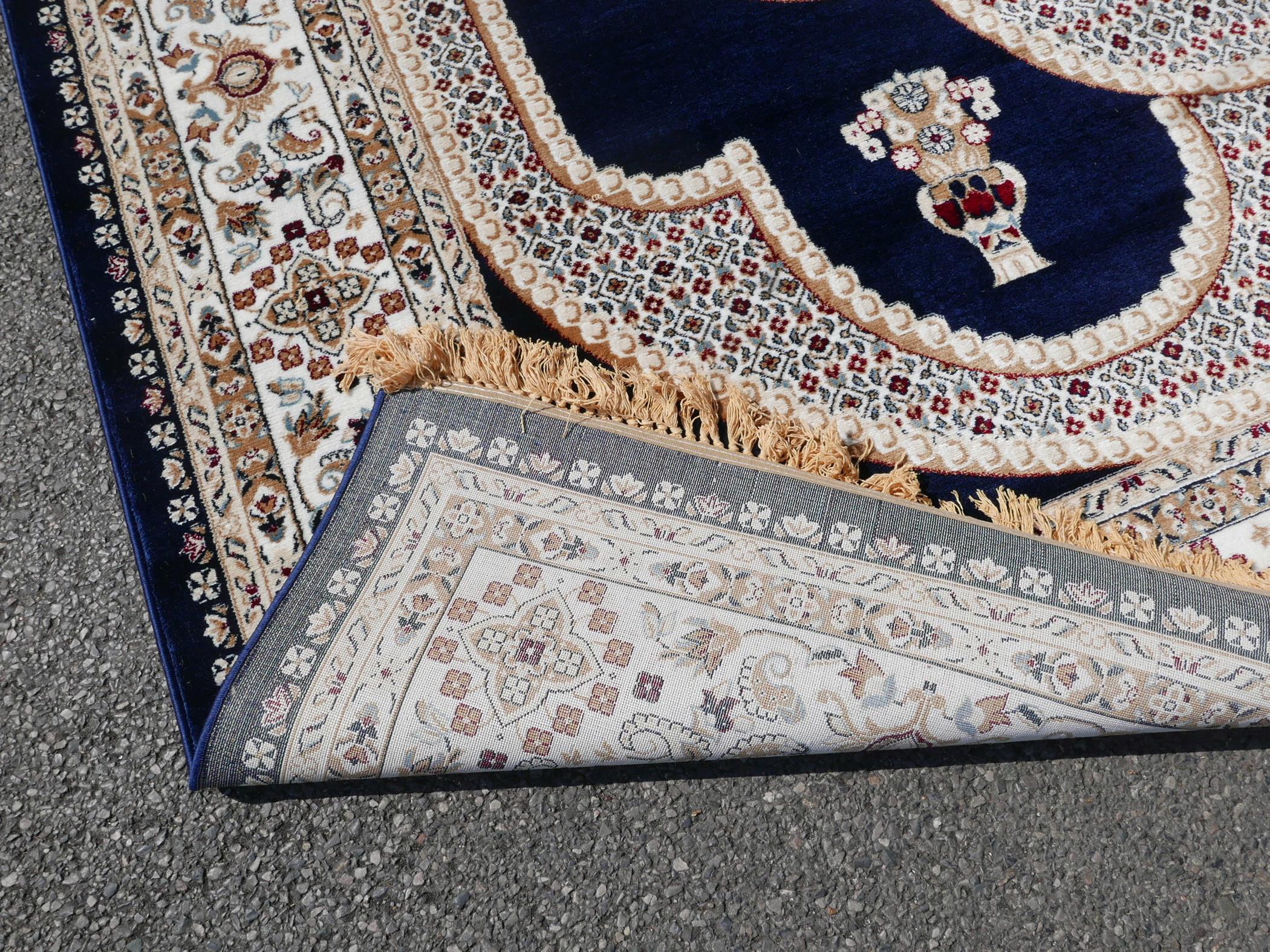 A large Turkish blue ground carpet with all over floral decoration, 118" x 240" - Image 7 of 7