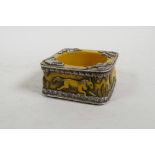 An Indian white metal mounted amber style bangle with animal decoration, 3½" x 3½"
