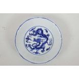 A Chinese blue and white porcelain dish with a lobed rim and dragon decoration, 6 character mark