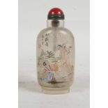 A Chinese reverse decorated snuff bottle depicting an erotic scene, 3½" high