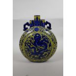 A Chinese yellow ground porcelain triple stem moon flask with two handles, blue and white dragon and