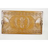 An Arts and Crafts carved oak serving tray with brass handles, 26" x 14½"