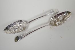 A pair of Georgian hallmarked silver berry spoons, c.1775, marks rubbed, believed by William