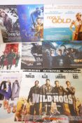 A quantity of movie posters mounted on board to include Mamma Mia, Eragon, Beowulf, Inglorious