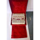 An Italian piano accordion with elaborate inlaid decoration marked Italia Cooperative L'Armonica