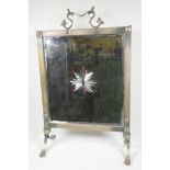 A late C19th architectural brass firescreen with star cut mirrored panel, 27" high