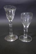 A heavy Georgian cut glass cordial glass with engraved conical bowl and faceted stem (chip to foot),