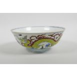 A Chinese doucai porcelain bowl decorated with dragons, six character mark to base, 7" diameter