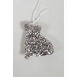 A sterling silver brooch in the form of a pug in a sweater, 1" x 1½"