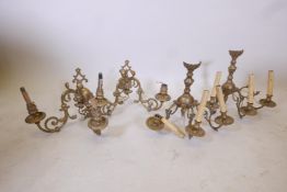 A pair of brass two branch wall lights, together with a pair of brass three branch wall lights, 12½?