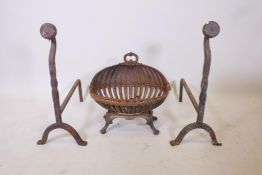 A cast iron clam shell fire basket and two fire irons, basket 19" x 13" x 17" high