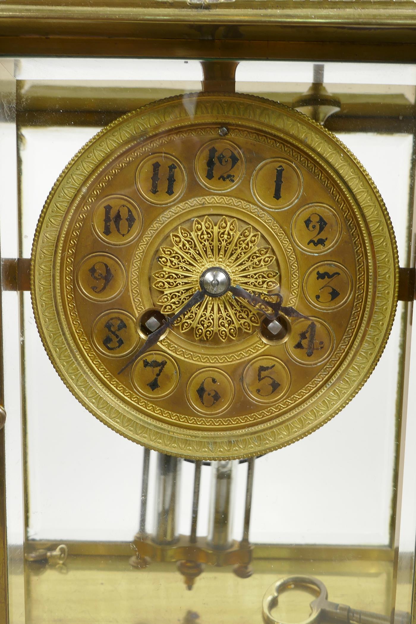 A French onyx and brass cased portico clock with enamelled columns decorated with classical maidens, - Image 4 of 5