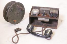 A British Army telephone set, D mk V and a reel of cable