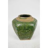 An C18th South China pottery storage jar, the surface with raised floral motifs below a mottled