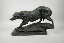 A bronze figure of a wolf, 17" long